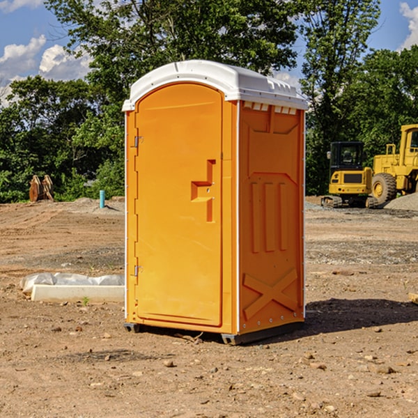 what is the cost difference between standard and deluxe portable restroom rentals in Treloar